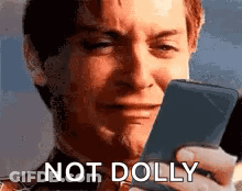 Man Crying Holding Cell Phone Not Dolly GIF