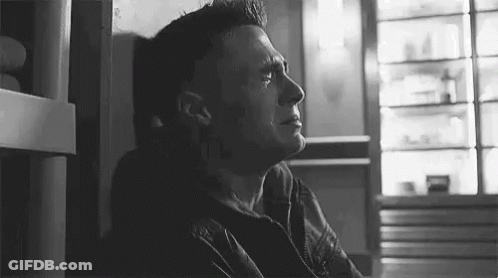 Man Crying In Black And White Photo Beside Wall GIF