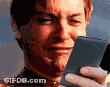 Man Crying Looking At Cellphone GIF