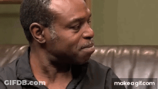 Man Crying On Couch Making Funny Face GIF
