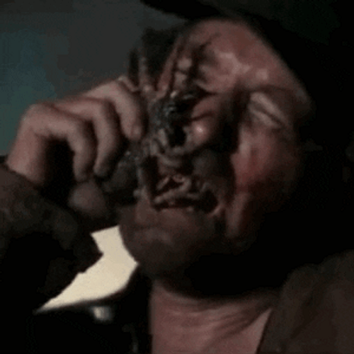 Man Crying Removing Spider GIF