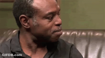 Man Crying While Sitting On Couch GIF