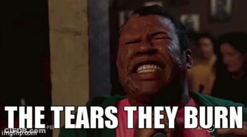 Man Crying With The Tears They Burn Behind Him GIF