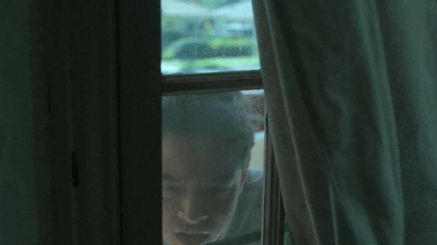 Man Curiously Looking Inside GIF