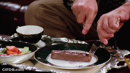 Man Cutting Chocolate With Knife And Fork GIF