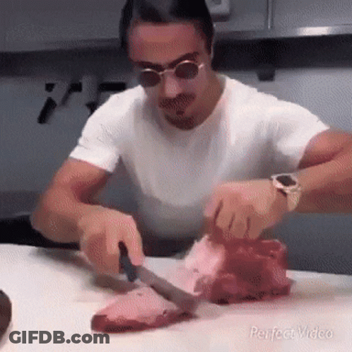 Man Cutting Meat With Knife GIF