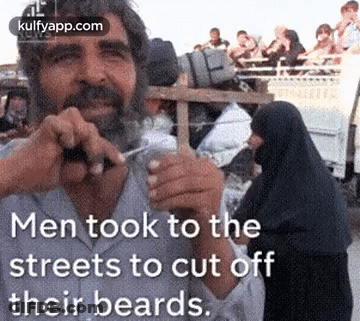 Man Cutting Off Beard With Scissors GIF