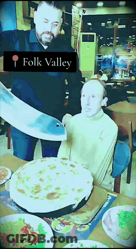 Man Cutting Pizza Saying Folk Valley GIF