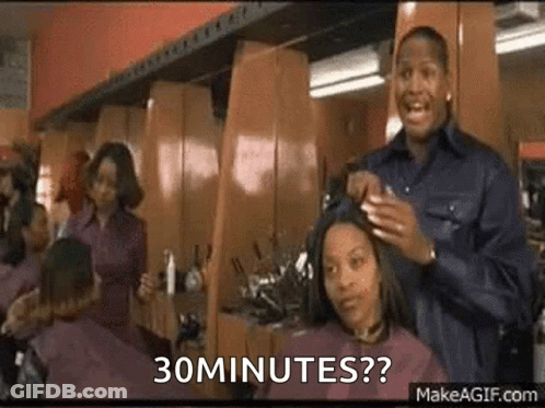 Man Cutting Woman's Hair Says 30 Minutes GIF
