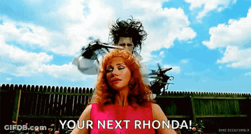 Man Cutting Woman's Hair With Scissors GIF