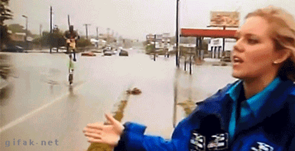 Man Cycling Behind The Reporter After Hurricane Meme GIF