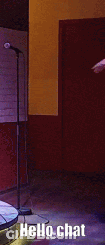 Man Dancing At Microphone Saying Hello Chat GIF