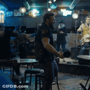 Man Dancing In Bar With The Sign GIF