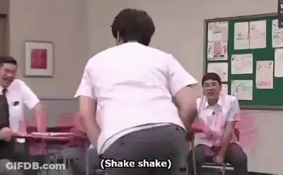 Man Dancing In Classroom While Men Sit At Desks GIF