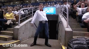 Man Dancing In Front Of Bell Sign GIF