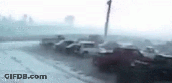 Man Dancing In Front Of Car In Foggy Street GIF