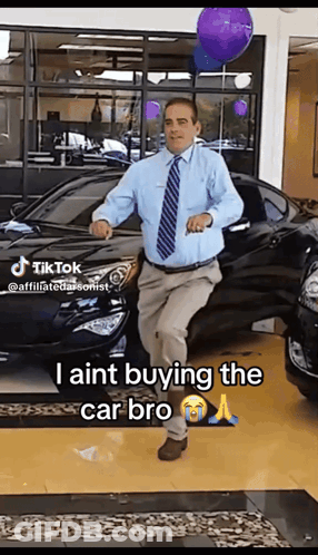 Man Dancing In Front Of Car Saying I Aint Buying GIF