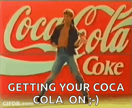 Man Dancing In Front Of Coca Cola Sign GIF