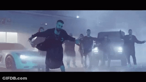 Man Dancing In Front Of Crowd And Car GIF