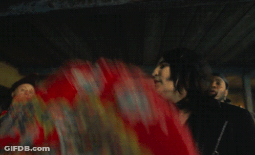 Man Dancing In Front Of Dick Tarp Sign GIF