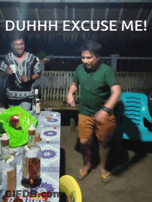 Man Dancing In Front Of Duhh Excuse Me Table GIF