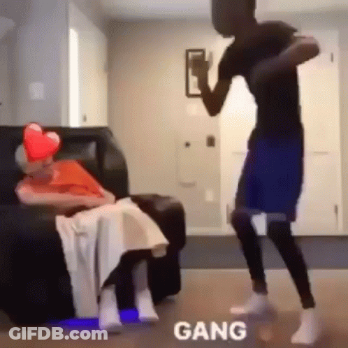 Man Dancing In Front Of Elderly Woman On Couch GIF