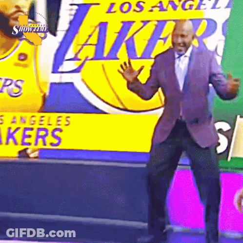 Man Dancing In Front Of Lakers Banner GIF