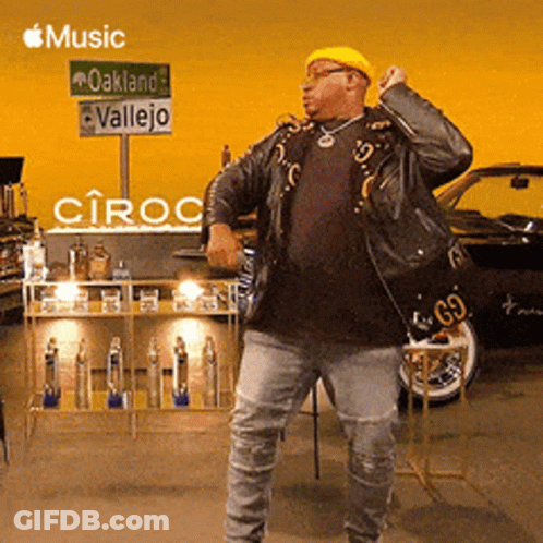 Man Dancing In Front Of Oakland Vallejo Sign GIF