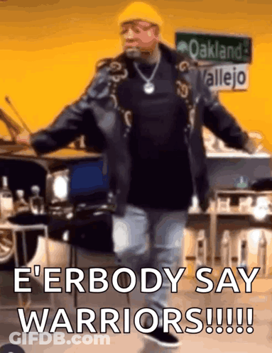 Man Dancing In Front Of Oakland Valley Sign GIF