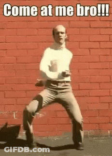 Man Dancing In Front Of Red Brick Wall Saying Come At Me Bro GIF
