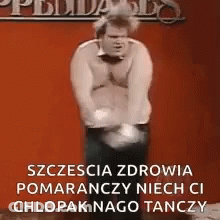 Man Dancing In Front Of Red Wall GIF