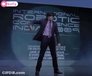 Man Dancing In Front Of Robotic Conference Sign GIF