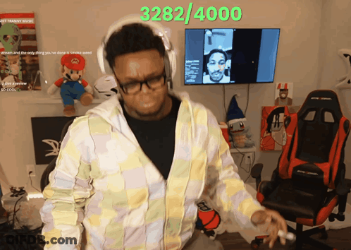 Man Dancing In Front Of TV Saying 3:282/4000 GIF