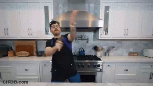 Man Dancing In Kitchen With Sword GIF