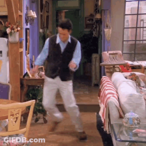 Man Dancing In Living Room With Couch GIF
