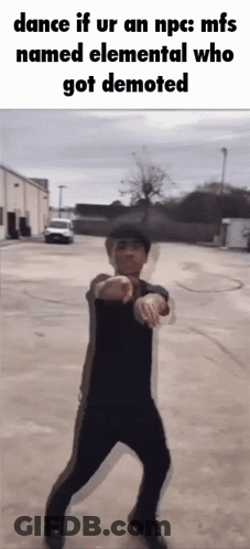 Man Dancing In Parking Lot In Front Of Building GIF