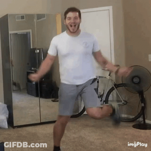 Man Dancing In Room With Fan And Bicycle GIF