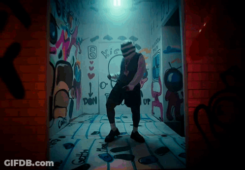 Man Dancing In Room With Kiss Graffiti GIF