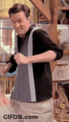 Man Dancing In Room With Lamp On Shelf GIF