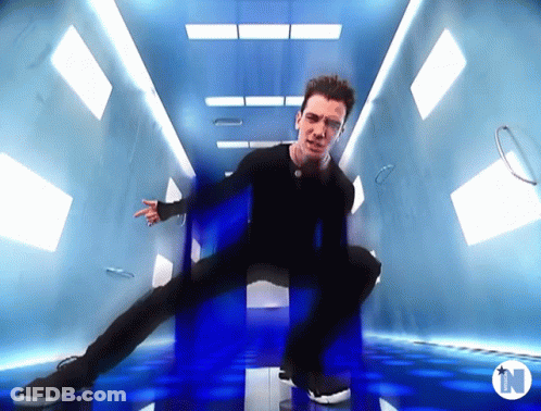 Man Dancing In Room With Letter N GIF