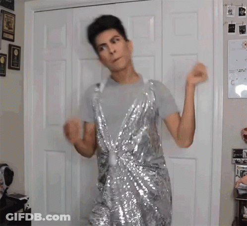 Man Dancing In Silver Sequin Dress GIF