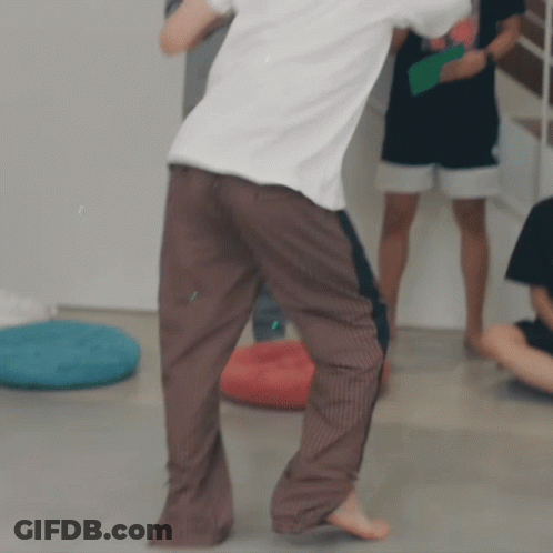 Man Dancing In White Shirt And Brown Pants GIF