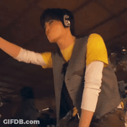 Man Dancing In Yellow Shirt And Brown Pants GIF