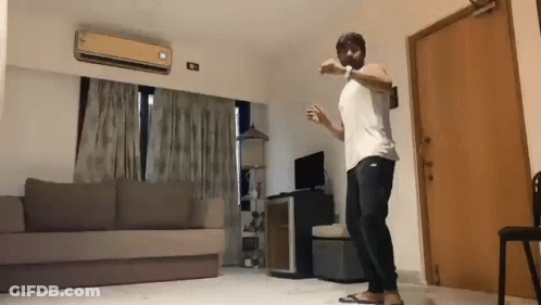Man Dancing Living Room With Couch And Door GIF