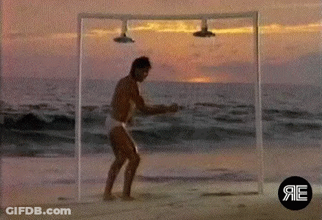 Man Dancing On Beach Under Shower GIF