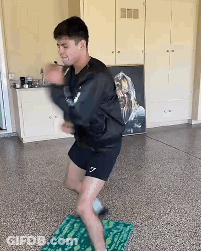 Man Dancing On Mat In Garage GIF