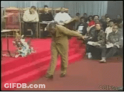 Man Dancing On Red Carpet For Crowd GIF