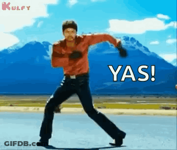 Man Dancing On Road In Front Of Mountain GIF