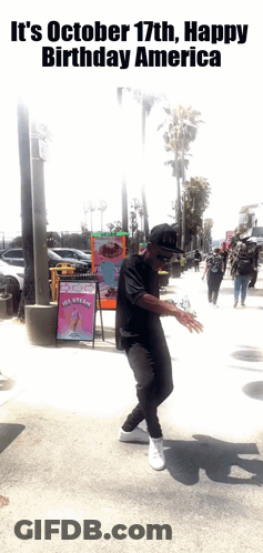 Man Dancing On Sidewalk In Front Of Ice Cream Sign GIF
