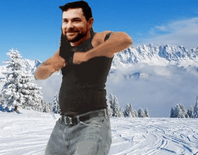 Man Dancing On Snowy Mountain GIF